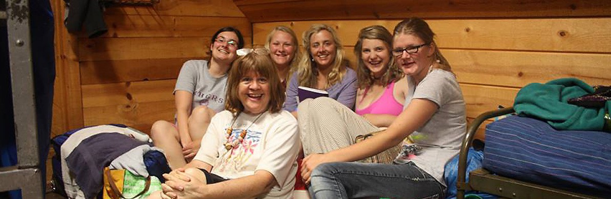5 women on cabin bed